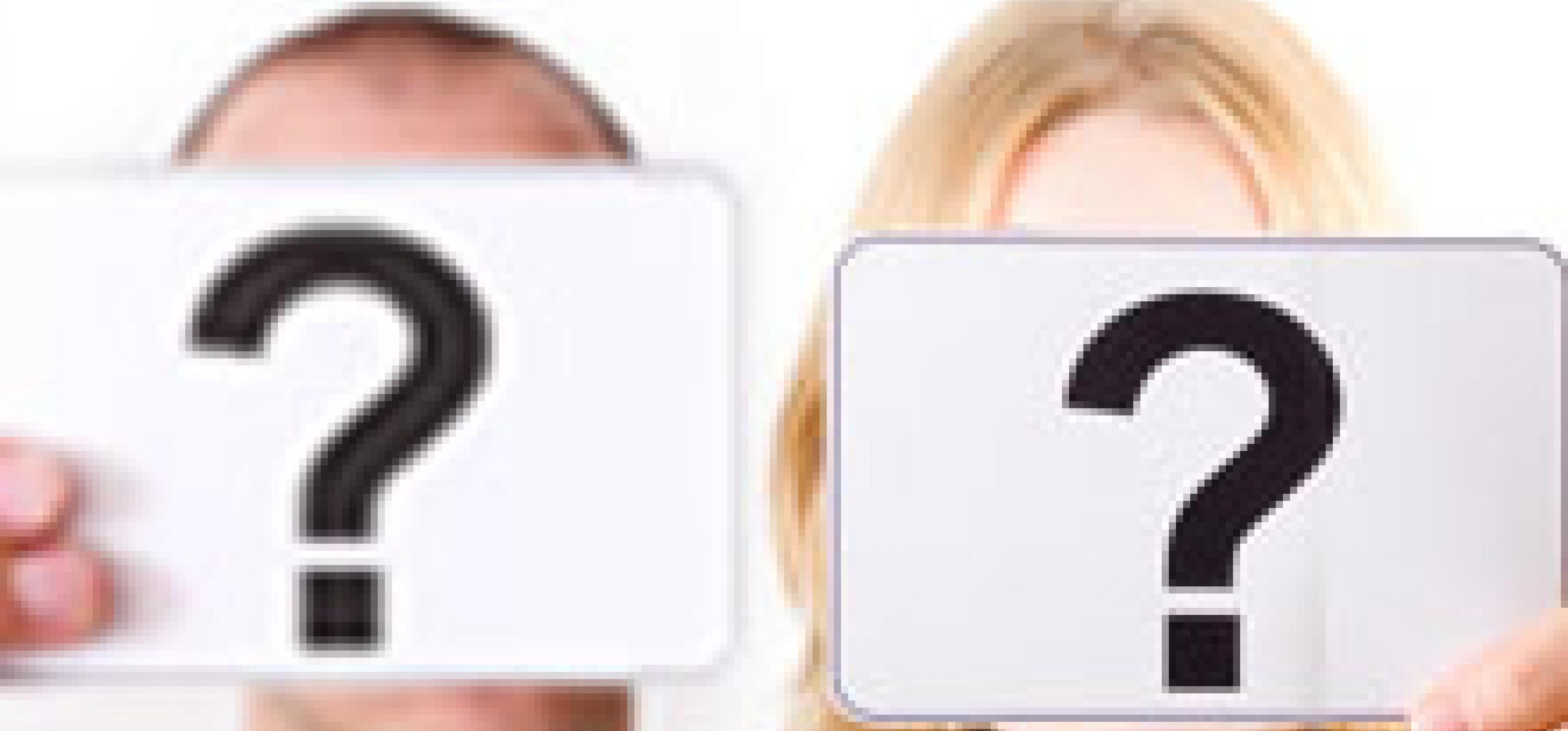 man and woman holding question marks in front of their faces